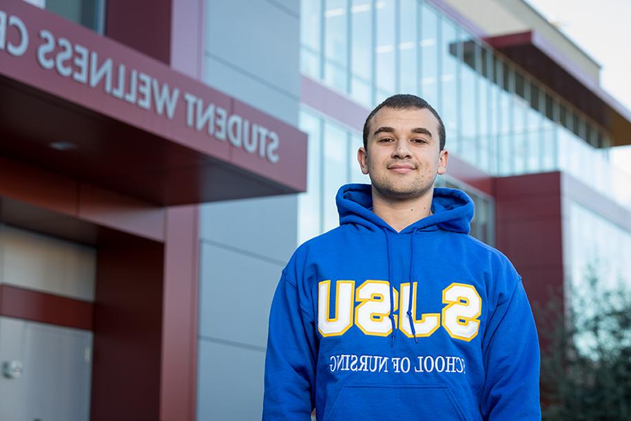 Student outside of Student Wellness Center.